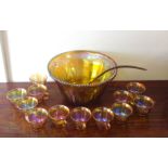 Carnival glass punch bowl and twelve gla