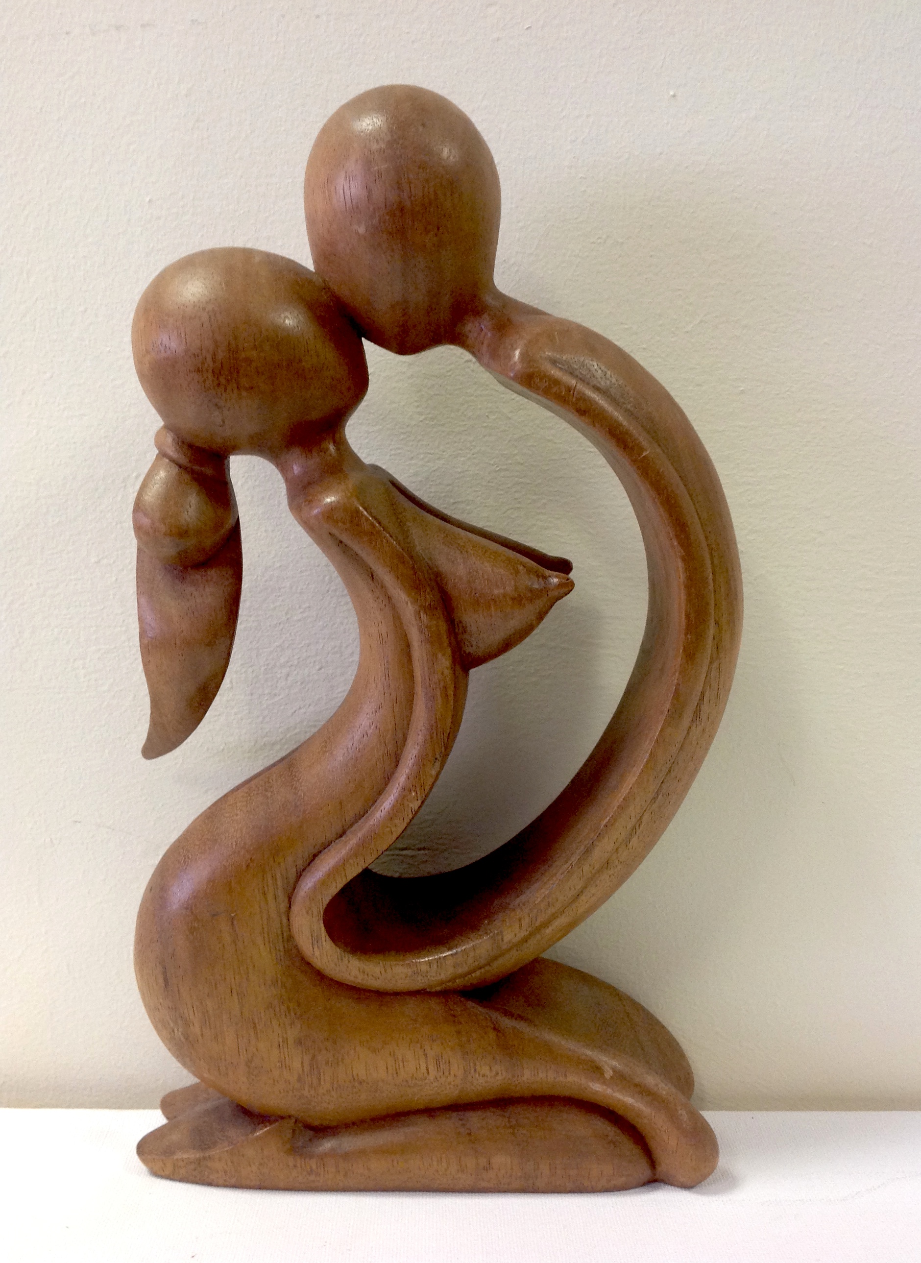 An abstract figural erotic carving. 29cm