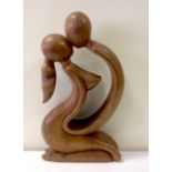 An abstract figural erotic carving. 29cm