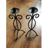 A pair of tripod legged curl design iron