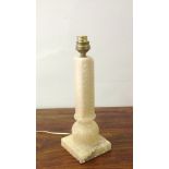 A carved 1960s Harrod's lamp base in Not