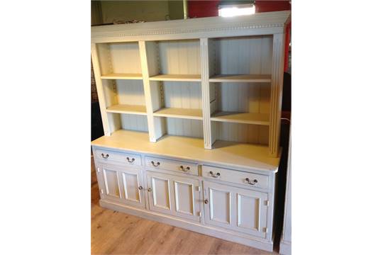 A large, three drawer, three cupboard, w