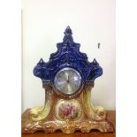 A painted Ansonia style porcelain clock.