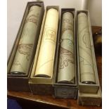 Four boxed piano rolls.