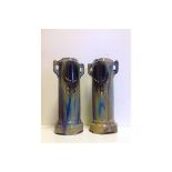 A pair of early 20th Century French Gothic revival tall vases