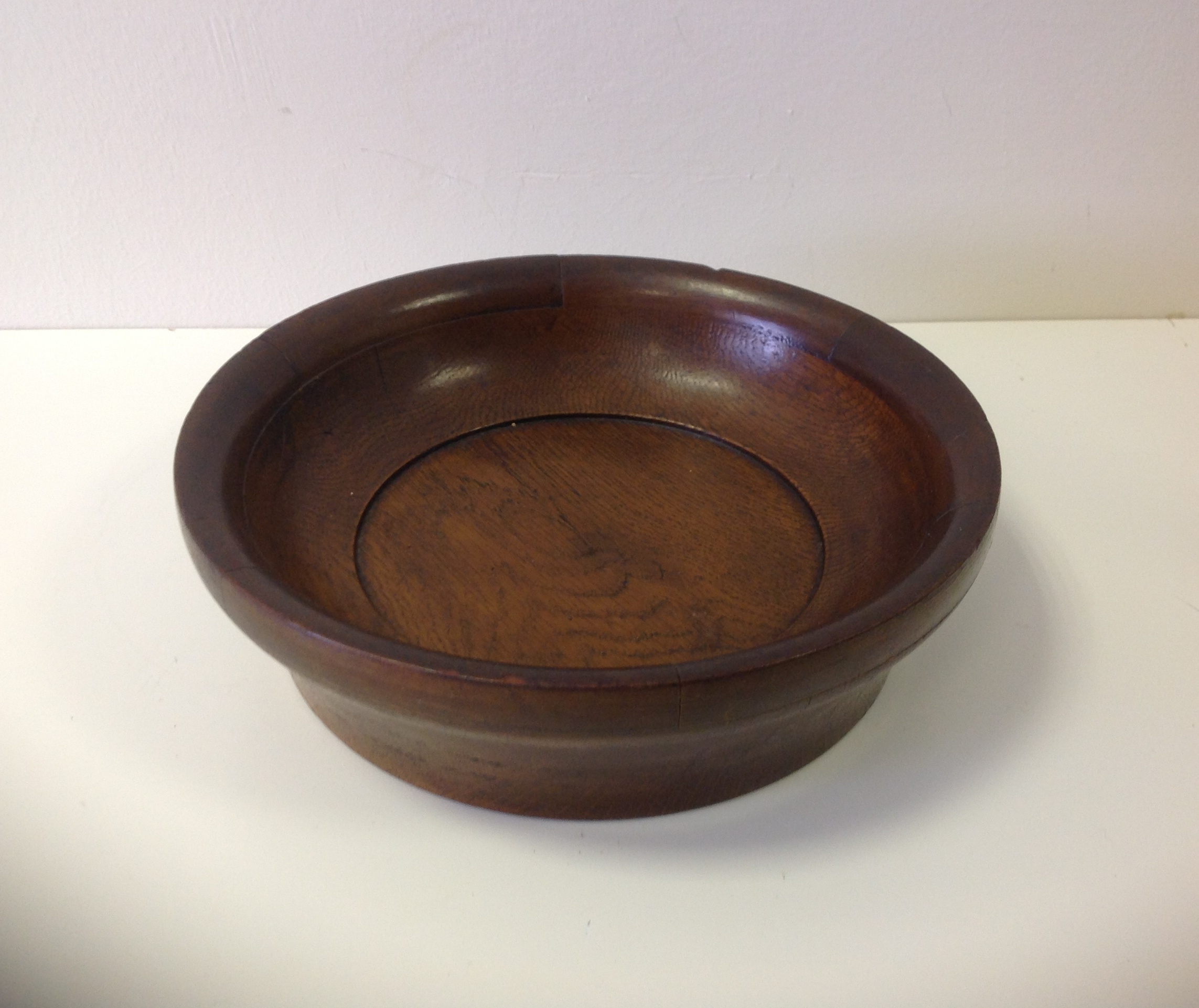 A circular Oak offering bowl.