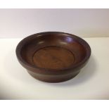 A circular Oak offering bowl.