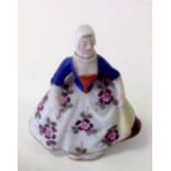 A 19thC porcelain figurine of a Dutch lady