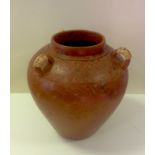 A large African earthenware triple handled vessel