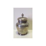 A pierced, silver plated, lidded container