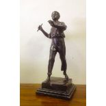 A signed bronze male mounted on a marble base.