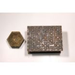 A copper trinket box with a smaller trinket box with figural decoration.