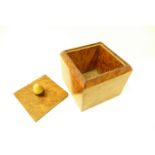 A solid burr yew wood tea caddy, with horn, acorn design handle. 12cm x 15cm x 12cm. 

The oral