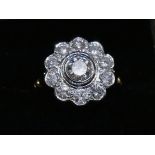 A 2 Carat round brilliant cut GSL1 colour G Diamond daisy ring, in 18 Carat yellow Gold. Size O.