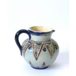 An early Martin Brothers Martin Ware jug. Signed on the base as Martin London. This piece is