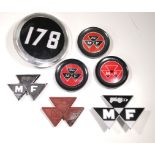 Seven tractors badges.