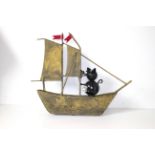 Metal cat in a boat. 33cm long.