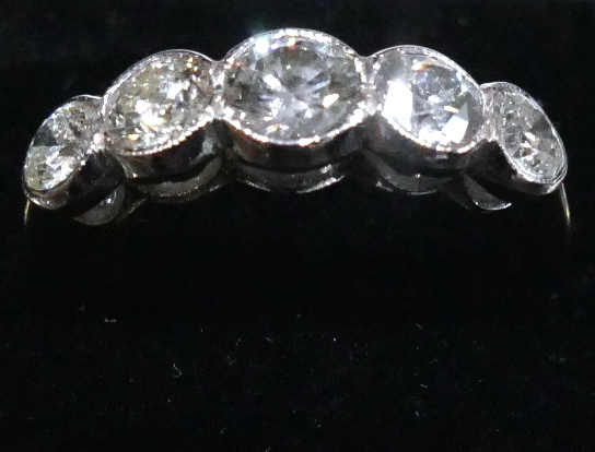 A 1.5 Carat round brilliant cut GSL1 colour G 5 stone Diamond ring, in 18 Carat white Gold. Size N.