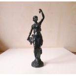 Spelter figurine of a classical lady carrying grapes. H35cm.