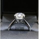 A 3 Carat round brilliant cut GSL1 colour G Diamond solitaire ring, in 18 Carat white Gold. Size M.