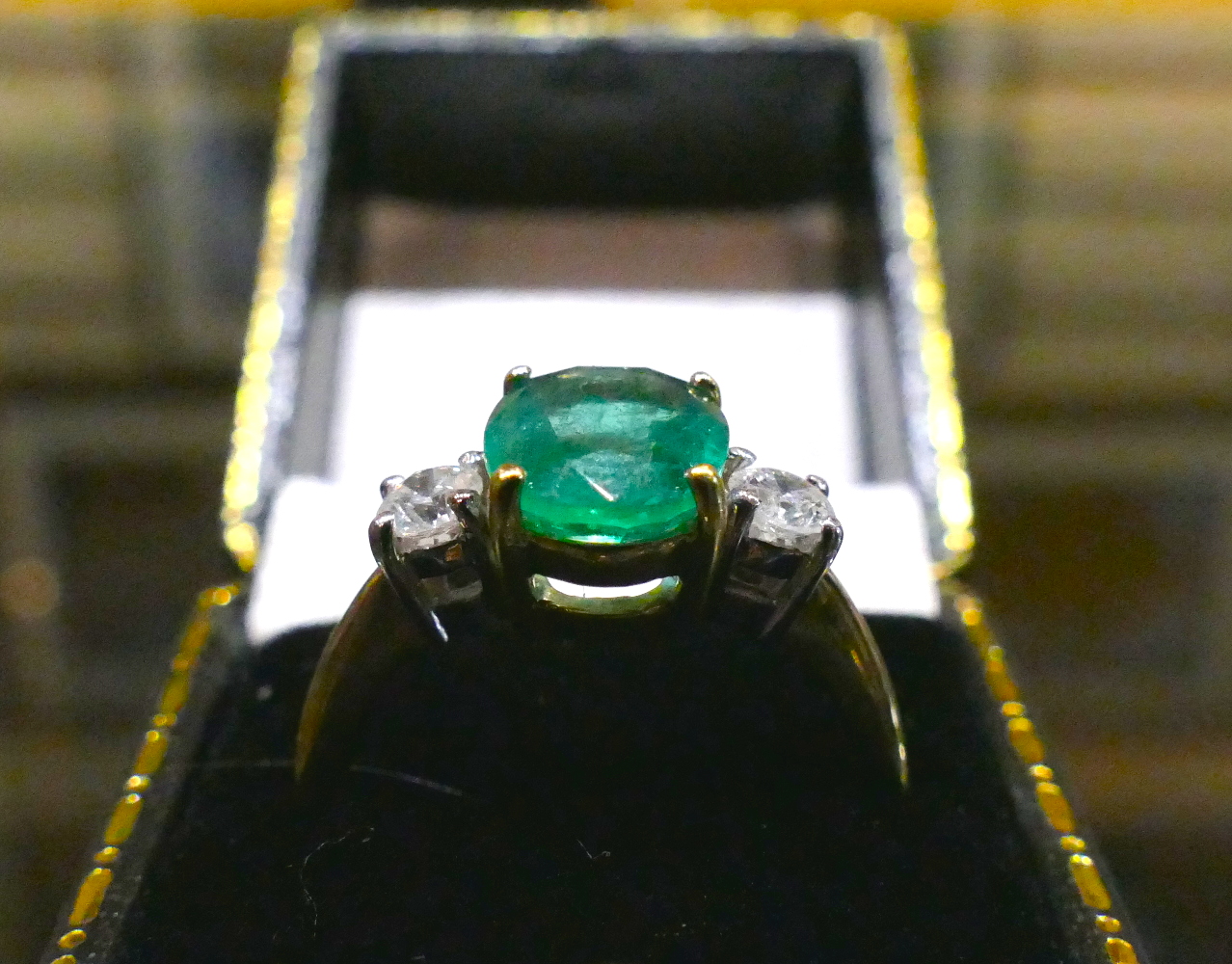 A 2.8 Carat oval Emerald and 0.40 Carat