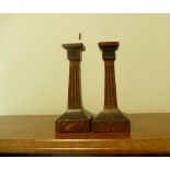 A pair of wooden Art Deco candlesticks.