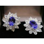 A pair of 2 Carat Tanzanite and 1 Carat round brilliant cut Diamond floral earrings, in 18 Carat