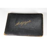 An early 20th Century leather bound autograph book, filled with signed watercolours, drawings and