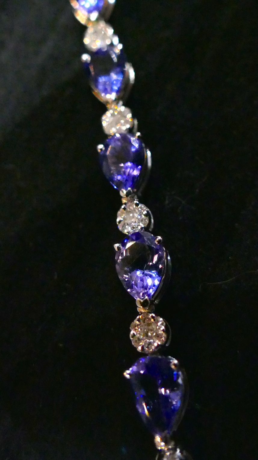 A pear cut Tanzanite and round brilliant cut Diamond bracelet, in 18 Carat white Gold. 9cm. - Image 3 of 4