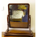 A large mahogany swing mirror. W65cm x H