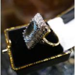 A 3.5 Carat emerald cut Aquamarine and 1.6 Carat brilliant round cut Diamond ring, in 18 Carat
