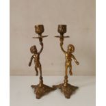 Pair of brass figural candle holders. H2