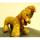 Mid 20thC stuffed donkey toy with leather mouth and woollen mane. 27cm long.