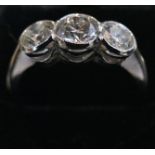 A 1.5 Carat GSL1 colour G round brilliant cut 3 stone Diamond ring, in 18 Carat white Gold. Size N.