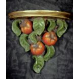 A plaster, wall hanging shelf bracket, of fruit design