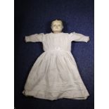 A Russian doll with a terracotta head. 66cm