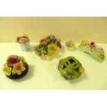 A collection of ceramic floral arrangements