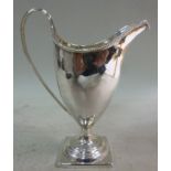 A George III silver cream jug, having a