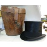 A late 19thC black silk top hat, bears t