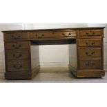 A 1920s mahogany desk, having a brown to