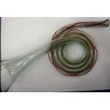 A 19thC glass hunting horn, the coiled b