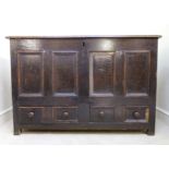 A mid 18thC panelled oak coffer, having