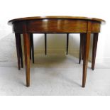 A Georgian mahogany dining table, having