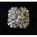 An 18ct white gold, claw set diamond clu