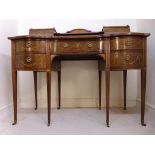 An Edwardian mahogany and marquetry desk
