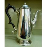 A Georgian style silver coffee pot of ta