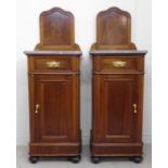 A pair of late 19thC French walnut bedsi