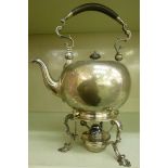 A Georgian style silver tea kettle of ov