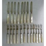 A set of eight silver dessert knives and