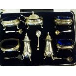 A seven piece silver condiments set of o